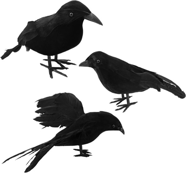 Three black feathered fake crows in different poses on a white background.