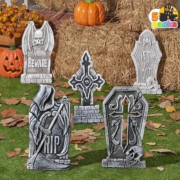 Five grey foam Halloween tombstones on grass: a winged skull with the word Beware, a cross, a hooded reaper with RIP, a stone with a skull and an arched stone.